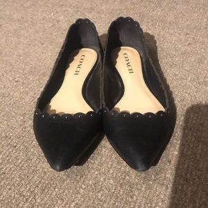 Black COACH flats with studded detail